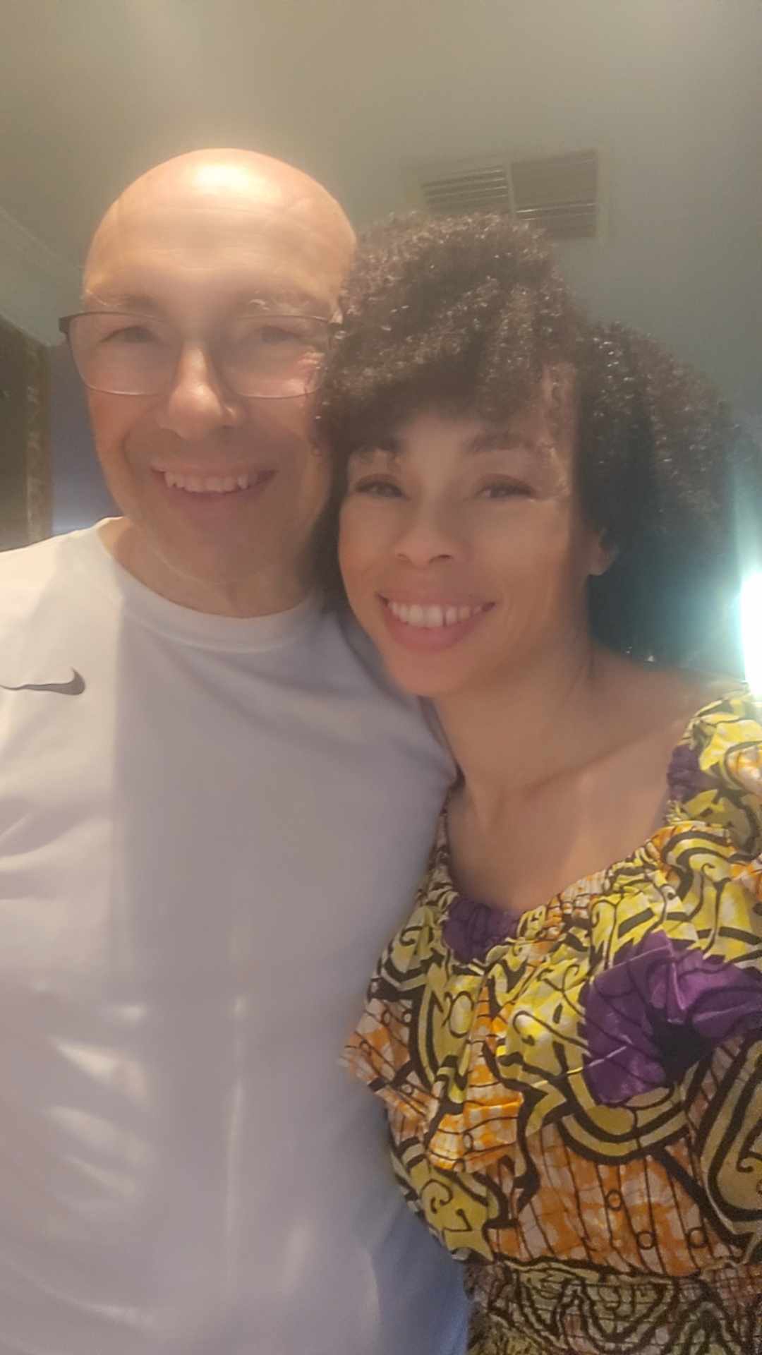 Candi smiling beside a client after time together