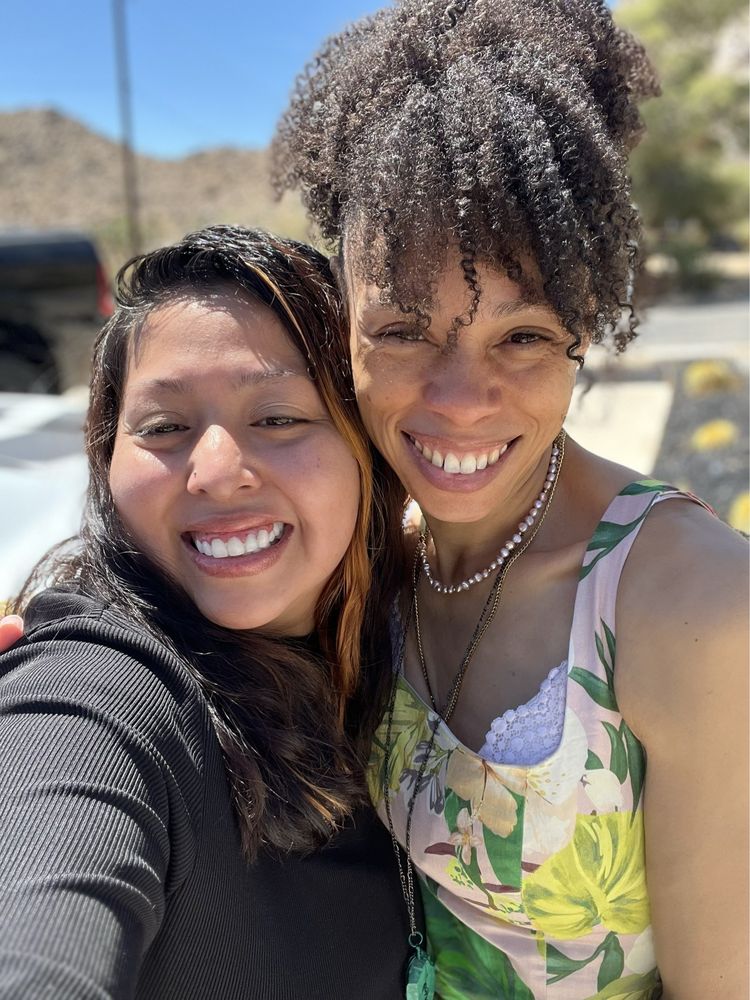 Candi smiling with Wendy in the sunlight